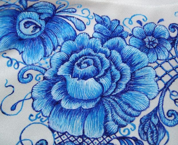 Imitation of stitches with blue acrylic paint on fabric