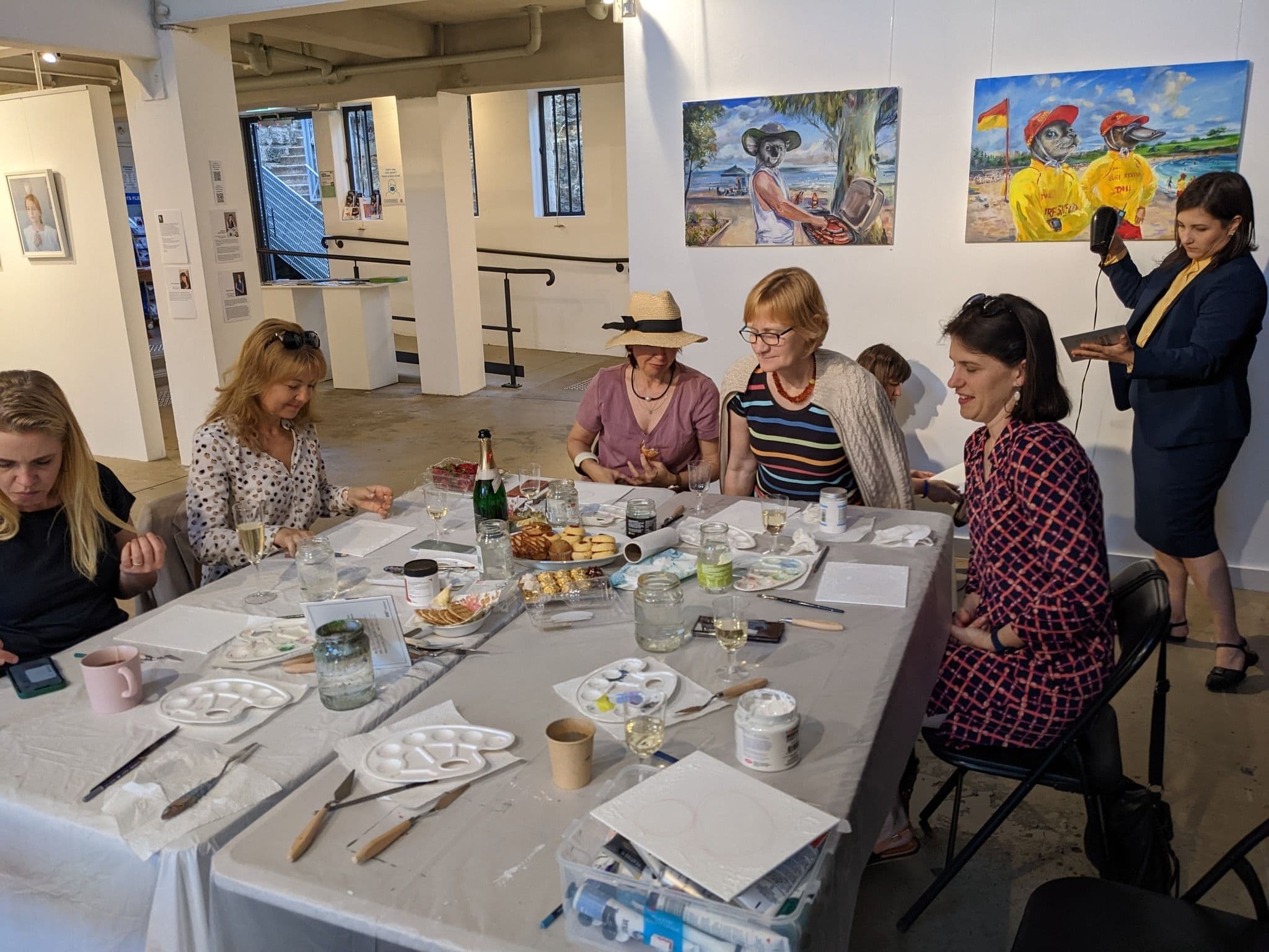 Participants around the table at the exhibition