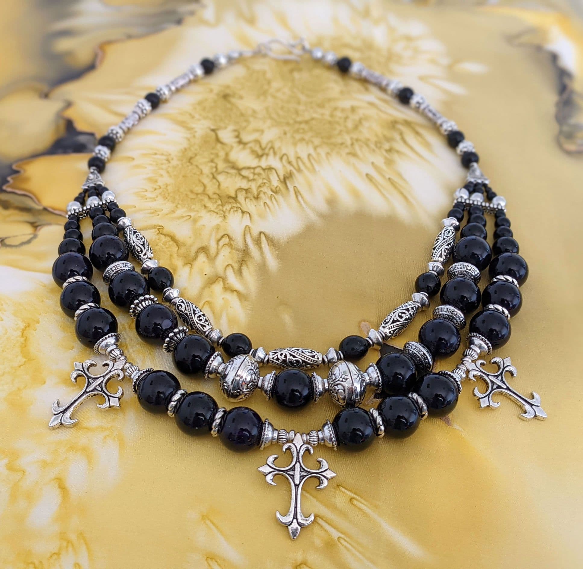 Black agate necklace on yellow background