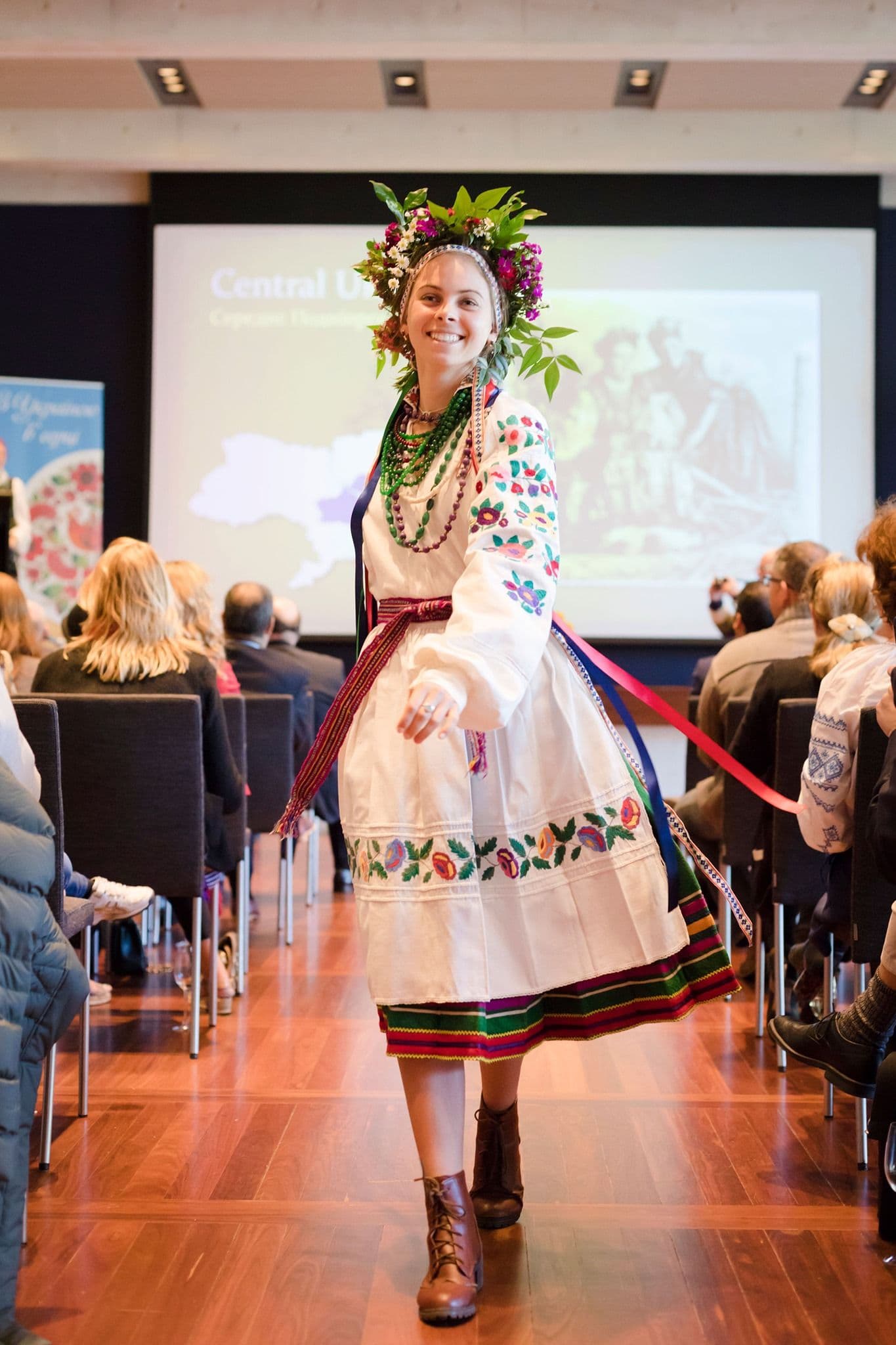 Model walking between raws of seats