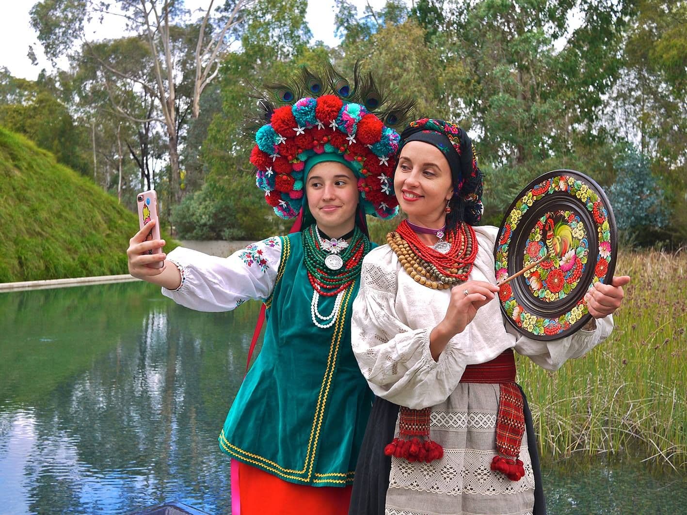 Girls in costumes are making selfie