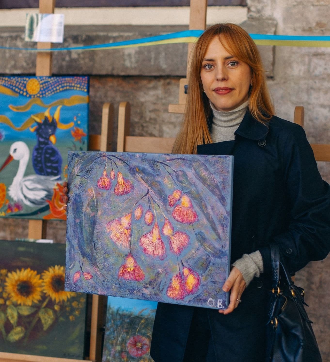 Participant of the workshop with her artwork