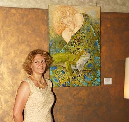 Artist in front of artwork
