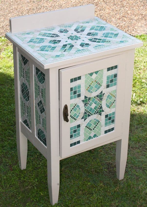 Mosaic side table with green and white geometric decor