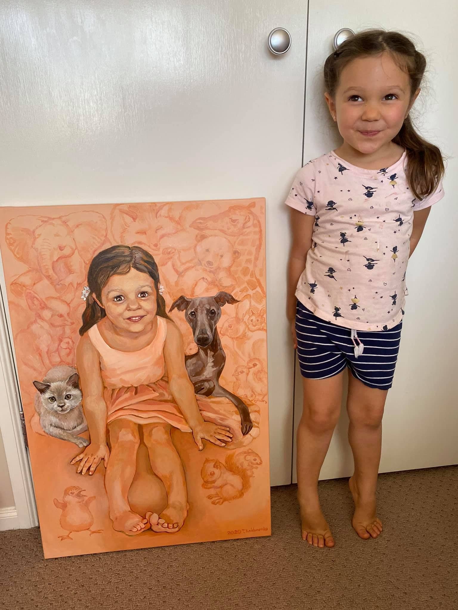Little girl with her portrait