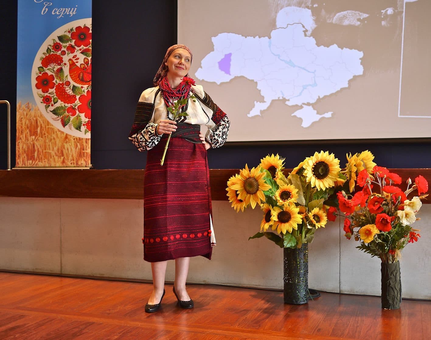 Model posing next to the stage