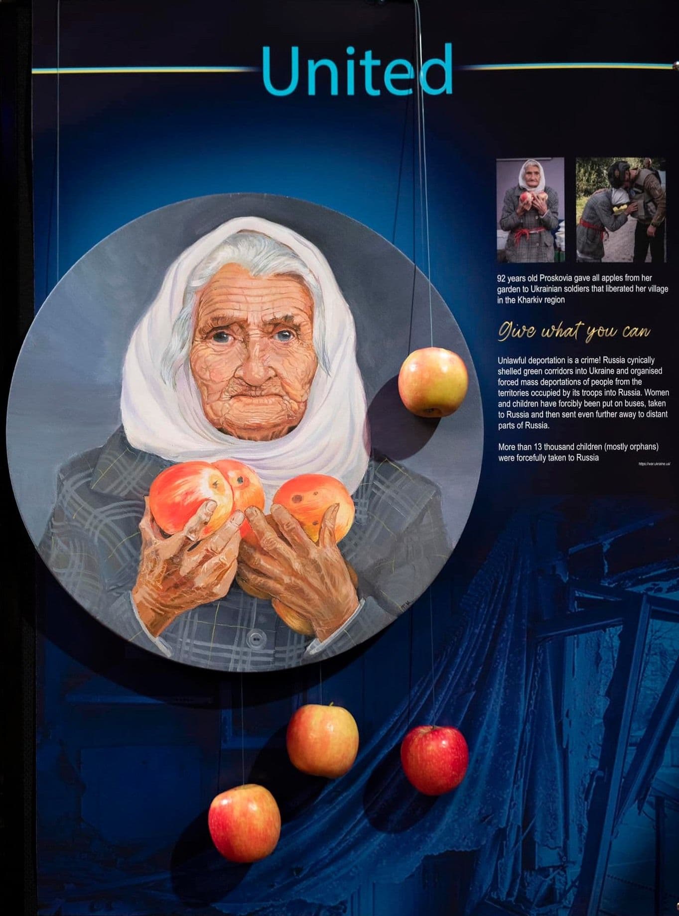 An old lady holding apples