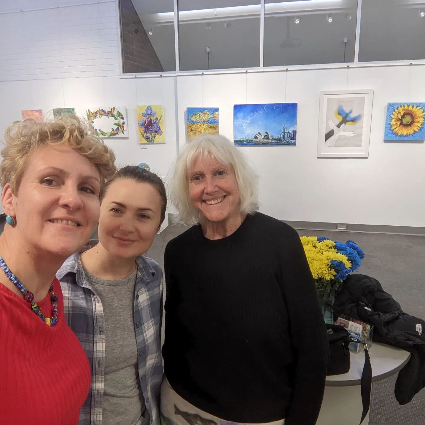 Artists and visitors at the exhibition