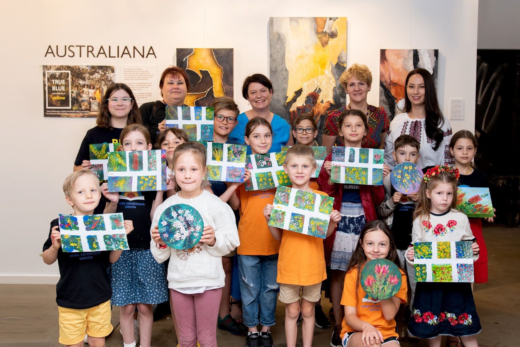 Mayor of Willoughby Tanya Tailor, director of Ukrainian school artist Tetiana Koldunenko and kids at the exhibition