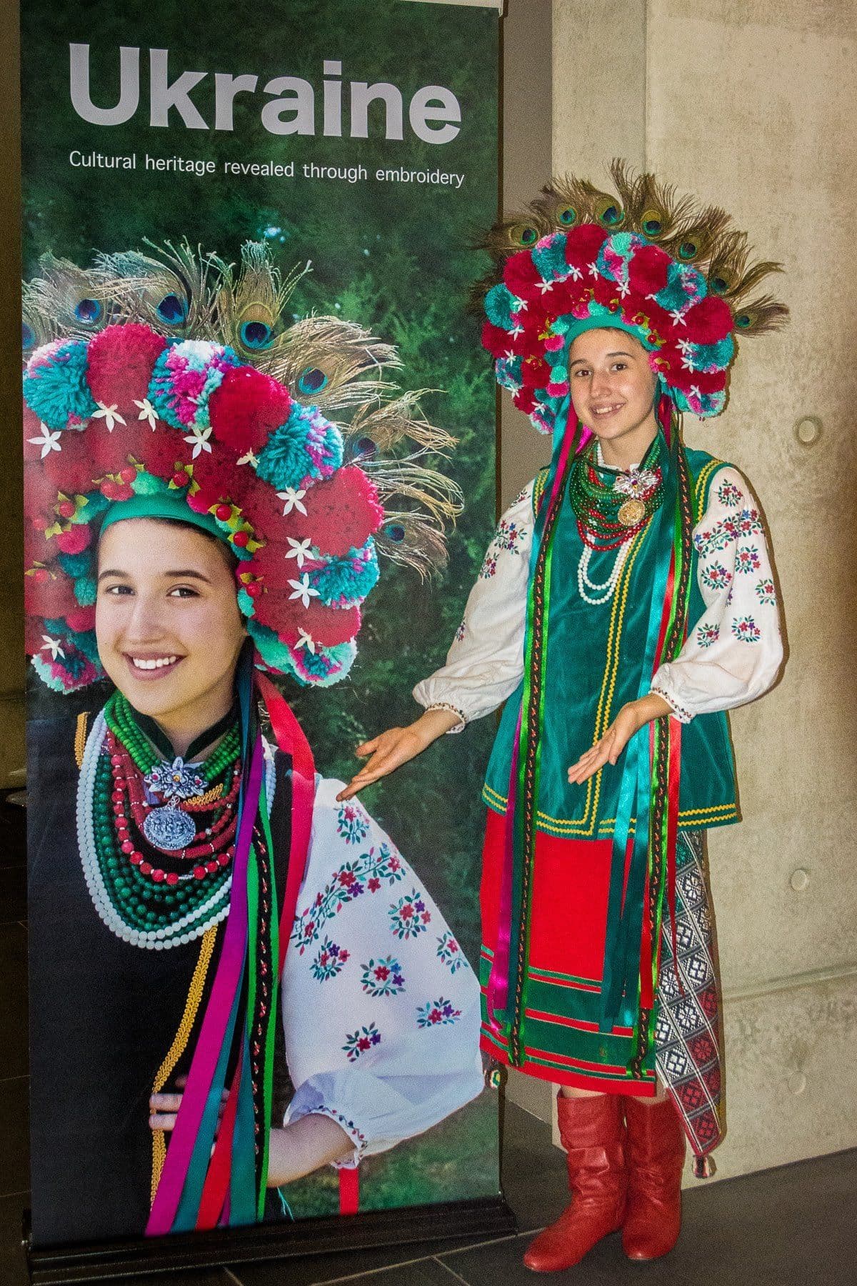 Polina in front of banner